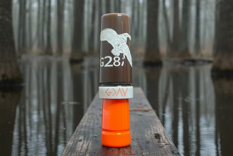 Brown, orange and ivory polished speck goose call