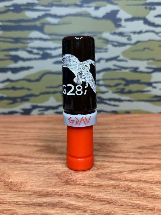 Brown, orange and ivory polished speck goose call