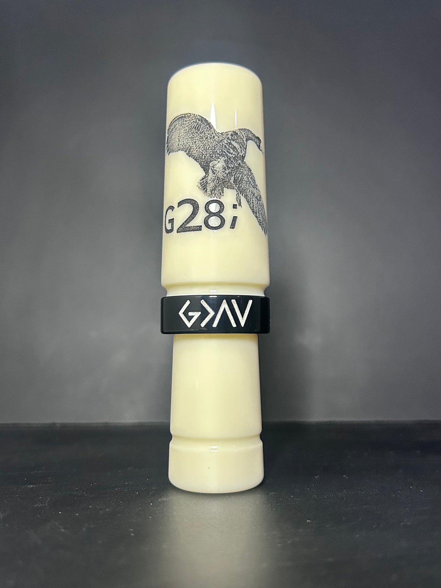 Ivory and black polished speck goose call